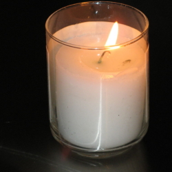 "A lit Yahrtzeit candle, a candle that is lit on the Hebrew anniversary of a loved one's death." (credit: Elipongo, license: PD)